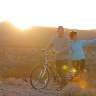 couple on bike ride at sunset