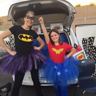 girls dressed as dc super heroes